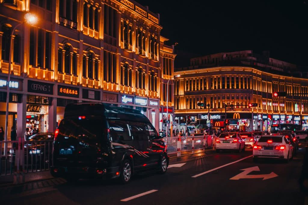 Luxury car service from Manhattan to Long Island with professional black car in smooth motion Luxury car service from Manhattan to Long Island with professional black car in smooth motion