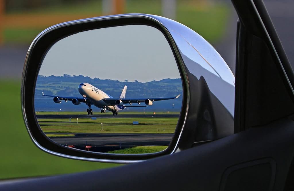 Laguardia Vs Jfk Airport Black Car Sedan At New York City Airport Curb