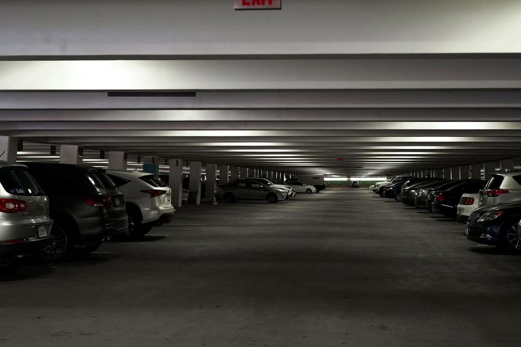 Laguardia Vs Jfk Airport Comparison Black Car Sedan At New York City Airport Curb With Family Luggage And Stroller